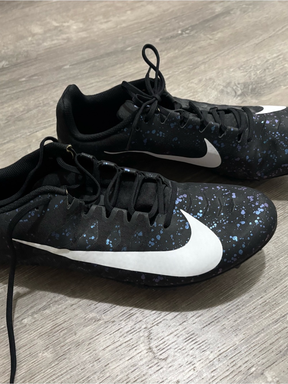 Nike Kids Black Sneakers with Blue Speckle and White Swoosh